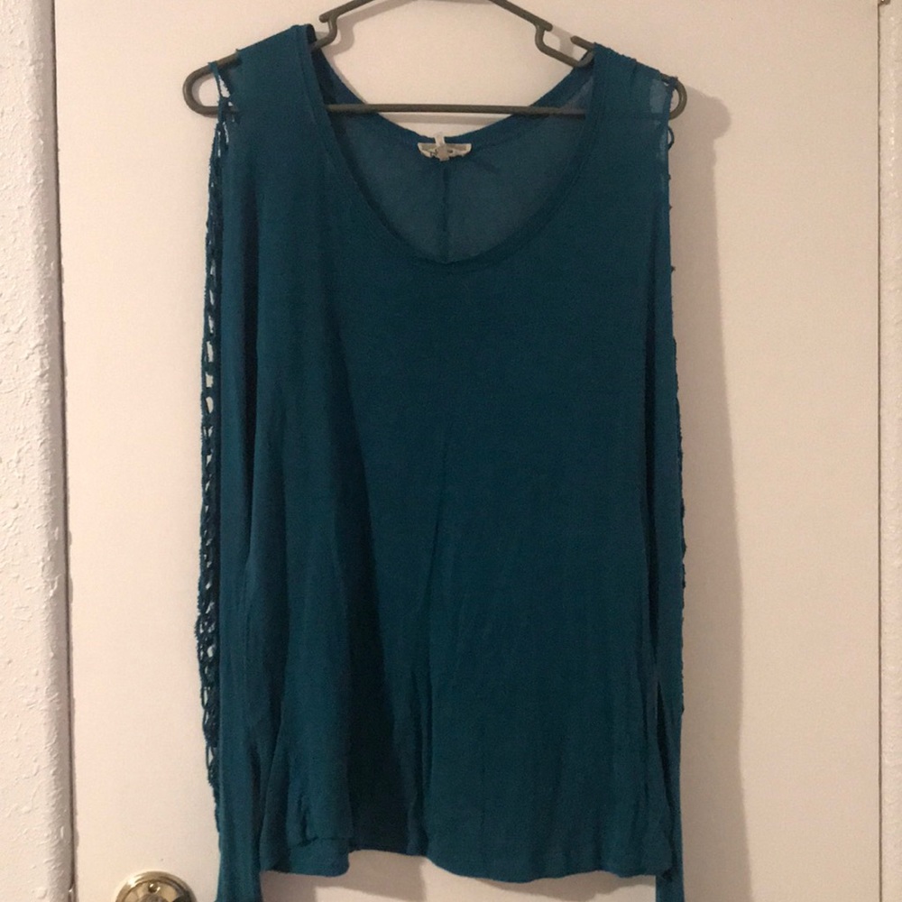 Greenish teal long sleeve shirt.